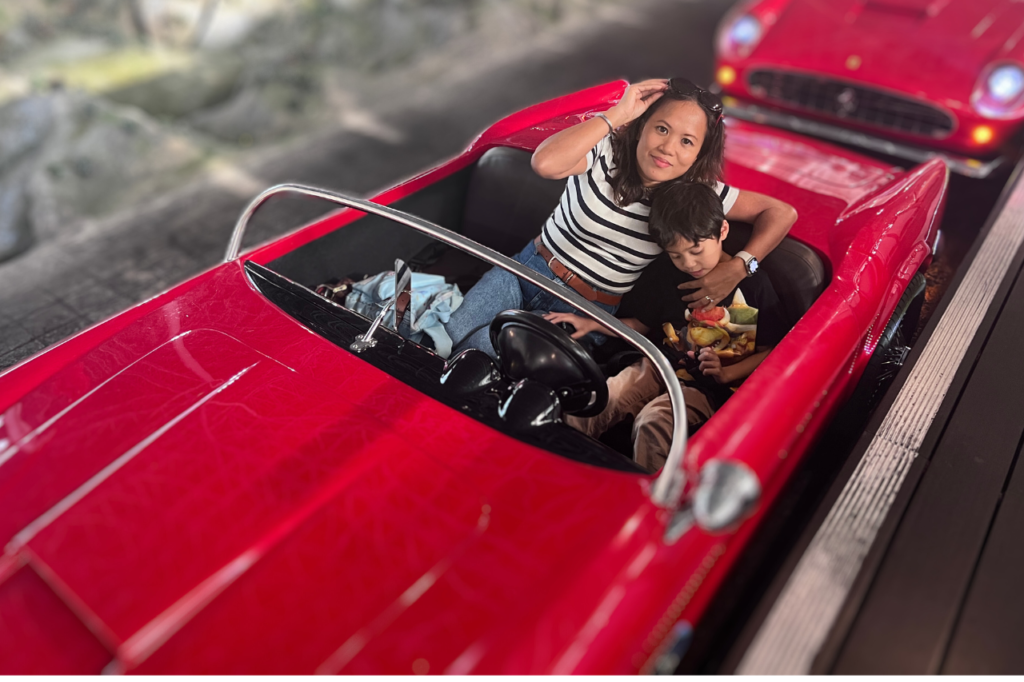Exploring Little Italy's Charms Behind the Wheel of a Miniature Ferrari 250 California.